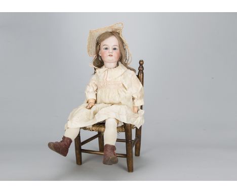 A large Armand Marseille child doll,  with blue sleeping eyes, blonde hair wig, jointed composition body, cream silk dress, u