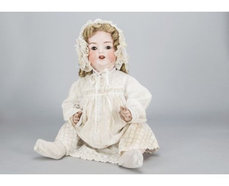 A large Ernst Heubach 342 baby doll, with brown sleeping eyes, blonde hair wig, composition bent-limbed body, white cotton dr