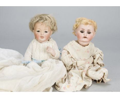 A Kestner 211 all-bisque character baby,  with brown sleeping eyes, blonde mohair wig, bent-limbed bisque body and robe —10in