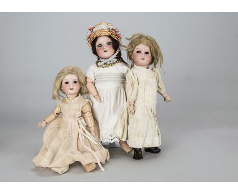 Three German child dolls,  a C M Bergmann 1916 with blue sleeping eyes, brown mohair wig, jointed composition body and white 