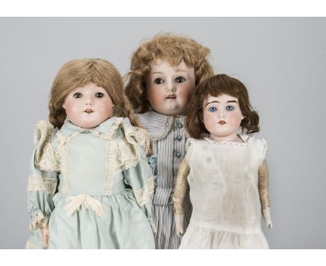 Three German child dolls,  a Max Oscar Arnold 201 with brown sleeping eyes, blonde mohair wig, jointed composition body and b