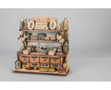 A French market wooden Epicerie shop circa 1910, with lithographed tinplate Penny Toy wall mounted telephone, the counter wit
