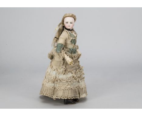 A French fashionable doll, probably Francois Gaultier, the pressed bisque head with pale blue striated eyes with dark rim, ea