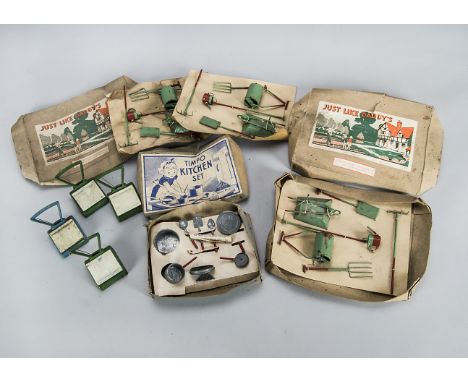 An unusual Metal Tube Products ‘Just Like Daddy’s’ dolls’ house gardening set, painted red and green, in original box; anothe