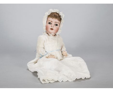A Franz Schmidt &amp; Co 1295 character baby,  with brown sleeping eyes, light brown mohair wig, composition bent limbed body