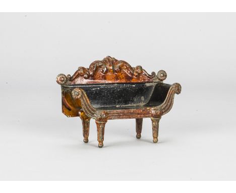 An Evans &amp; Cartwright tinplate sofa, painted with wood graining and black upholstery, Helen scratched into the back —6in.