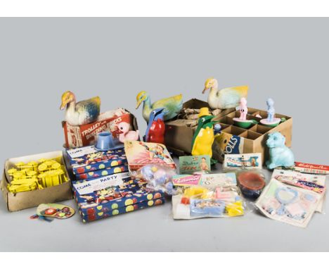 Plastic toys, a dozen trade box of Palitoy Tumbler Toys; a trade box of three plastic penguin money banks, another containing