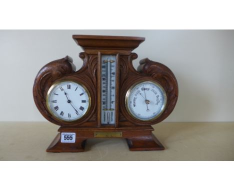 An early 20th century desk clock/thermometer/barometer oak carved case, presented to Capt. Fry by Lt. Col Tanner M.B.E. and O
