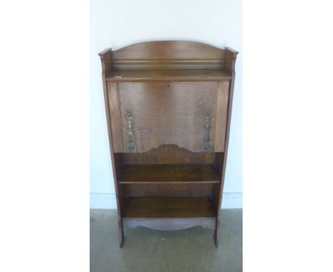 An Art Nouveau oak students bureau - Height 123cm x Width 65cm