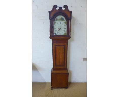 An 8 day oak and mahogany longcase clock with a painted arched 12" dial signed Jus Peters Cambridge in need of some restorati