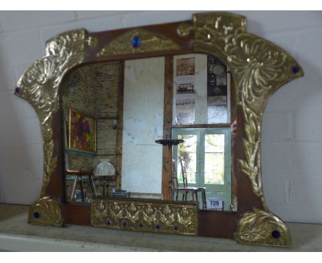 An Art Nouveau mirror with embossed brass work and glass "jewels" - 49cm x 64cm 