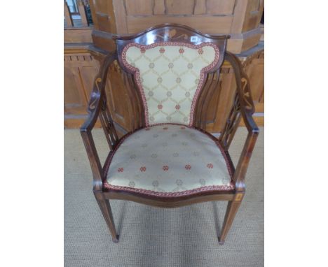 A mahogany framed and inlaid chair in the Art Nouveau manner