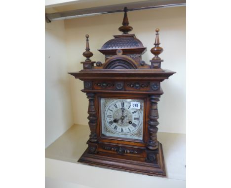 A mahogany cased mantle clock, Junghams movement, silvered dial with Roman numerals to chapter ring