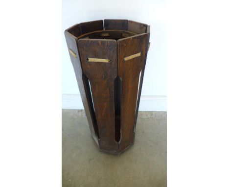 An Arts and Crafts octagonal oak stick stand - Height 64cm x Width 26cm