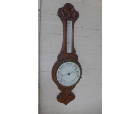 An oak aneroid barometer with thermometer - Height 85cm 