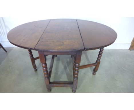 An 18th century oak gateleg table on bobbin supports - Height 22cm x 95cm x 124cm 