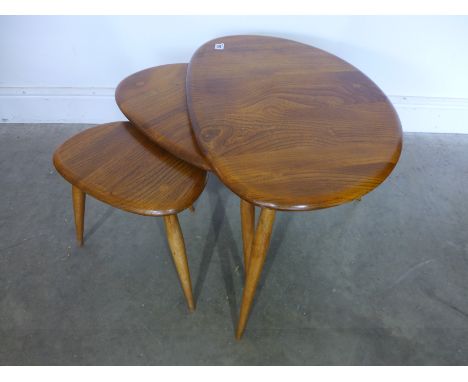 An Ercol nest of three "Pebble" elm tables 