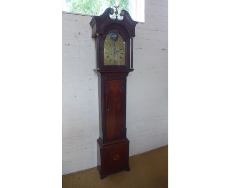 A mahogany 8 day striking longcase clock with rocking ship movement and arched 12 inch brass dial plaque named William Avanel