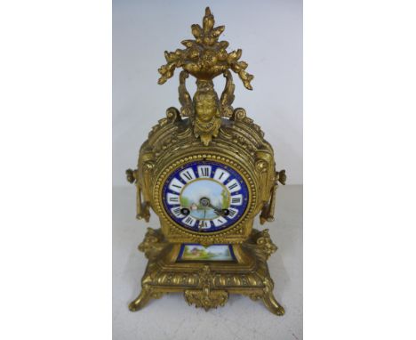 A Continental ormolu and porcelain mantel clock, the movement stamped  R & C - Height 31cm 