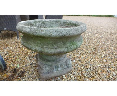 A large weathered stone effect planter on a lion plinth - Height 49cm x Width 57cm