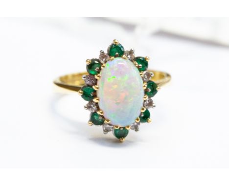 An 18ct gold, opal, emerald and diamond cluster ring, size M, total gross weight approx 4.8gms