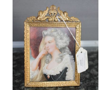 19th Century English School, a portrait miniature of a lady wearing a lace trimmed black dress, with her hand to her cheek, p