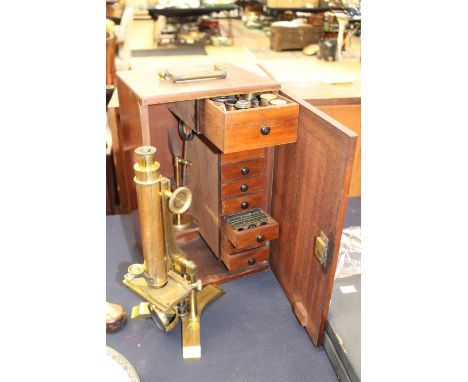 Scientific Instruments; A brass microscope retailed by F.B Dancere, Manchester, cased, within case are various interchangeabl