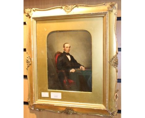 Late-19th Century portrait of a seated gentleman, oil on board (probably over a photographic base), in gilt frame