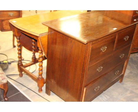 An early 20th Century oak gate leg table and an oak chest of drawers