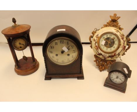 A collection of clocks including an Edwardian mantel clock and hanging example together with 1940's mantle and a modern examp