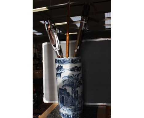 A reproduction Chinese stick stand with shooting sticks and others 