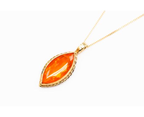 A 9ct gold fire opal coloured stone pendant, marquise shape with gold surround, approx 20mm in length, on a 9ct gold chain, t