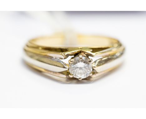 A diamond solitaire ring, brilliant cut diamond, approx 0.33 carat, claw set in yellow and white gold, unmarked probably 18ct