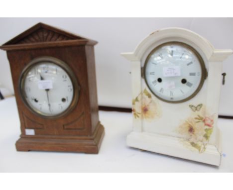An early 20th Century oak eight day mantle clock and a further eight day mantle clock with a painted case