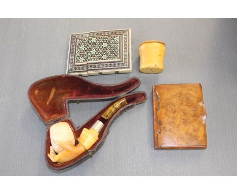 A cased Meerschaum pipe with a broken amber mouthpiece, together with a bone inlaid card case, a burr walnut card case and an