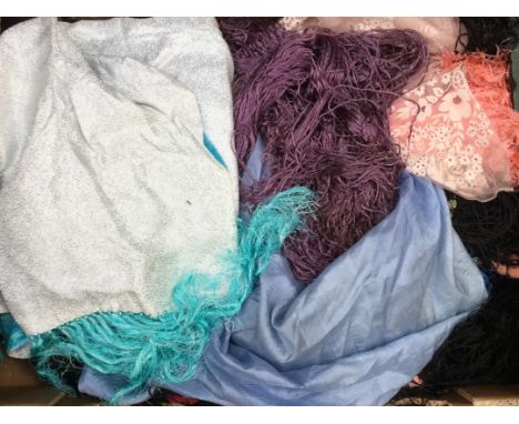 A collection of shawls to include; silk fringe (one has lilac embroidered flowers) and one 1920/30's; a fishnet shawl with pi