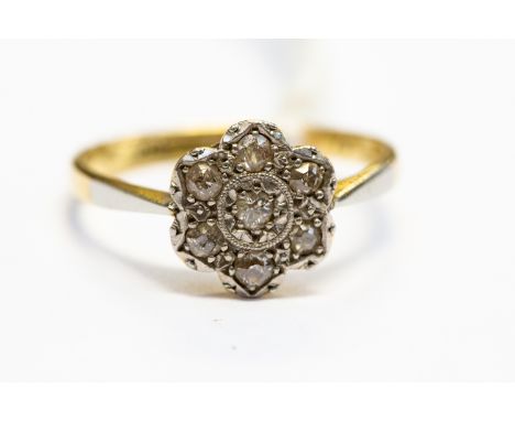 A diamond flower head cluster ring, set in 18ct gold, size O1/2, total gross weight approx 3gms