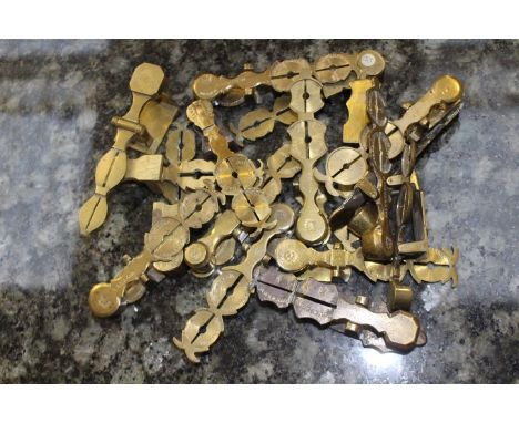 Seventeen various brass Sovereign scales 