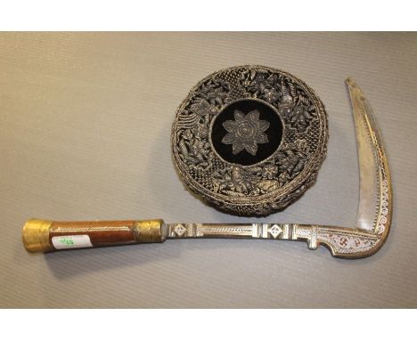  A Banochie tribal axe, with steel blade at right angles to the shaft, the blade and shaft with inlaid decoration to a turned