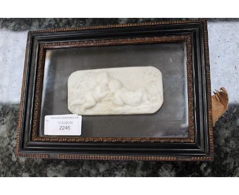 18th century canted rectangular panel plaque, decorated in raised relief with two cherubs in glazed frame, plaque 10.5cm wide