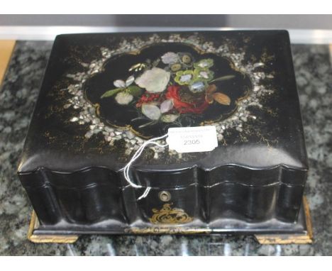 A mid 19th Century black papier mache work casket, circa 1860, the cover with a mother of pearl and abalone cartouche contain