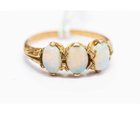 A 9ct. gold and opal ring, set row of three oval cabochon opals, shank hallmarked for 9 carat gold. (gross weight 2.7g)