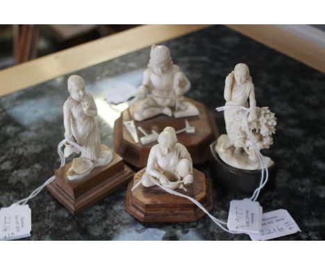 A series of four Indian ivory carvings, early 20th Century, one a lady with a basket, a female basket maker, a lady with a br