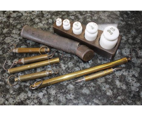 A set of five ceramic weight scales, six brass and steel spring balance scales, one steel balance scales 