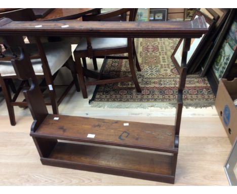 An early 20th Century gun rack with amunition shelf