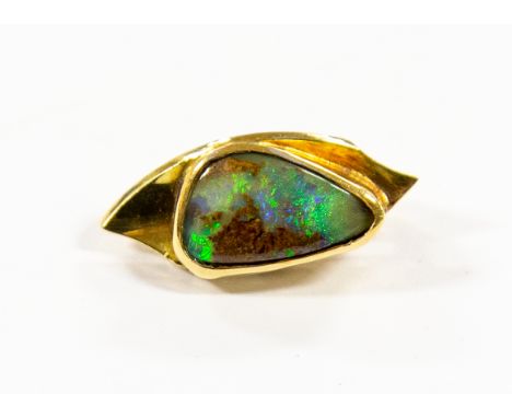 An 18 ct gold black opal set brooch 