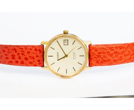 A 9ct gold cased Tissot watch (gents) with coral coloured leather strap, quartz 