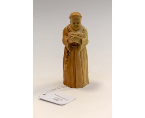 A Royal Worcester blush ivory candle snuffer modelled as a monk with book in hand, printed marks in puce, dated 1903, 12cm hi