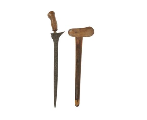 A MALAYSIAN KRIS DAGGER with carved walnut and gilt metal handle and rosewood lacquered scabbard, 61cm long 