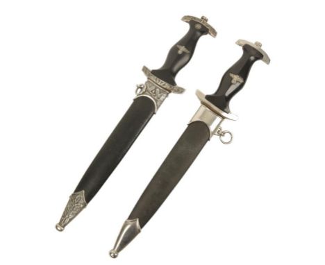 A SECOND WORLD WAR NAZI DAGGER with engraved blade No. M7/14, in original scabbard, and one other with engraved blade No M7/3